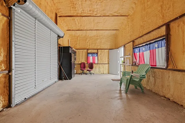 a view of chair and tables in patio