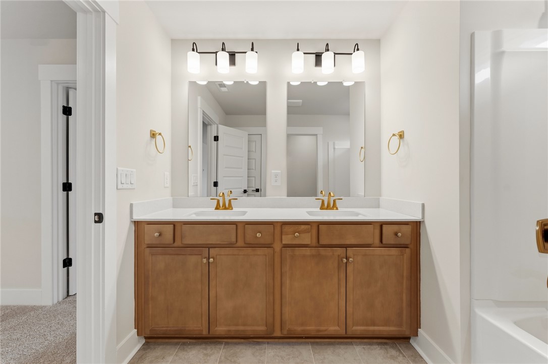 319 Summerall Drive Anderson, SC 29621 - Photo 29 of 37 This primary bathroom offers dual vanities with ample storage and sleek, functional fixtures.