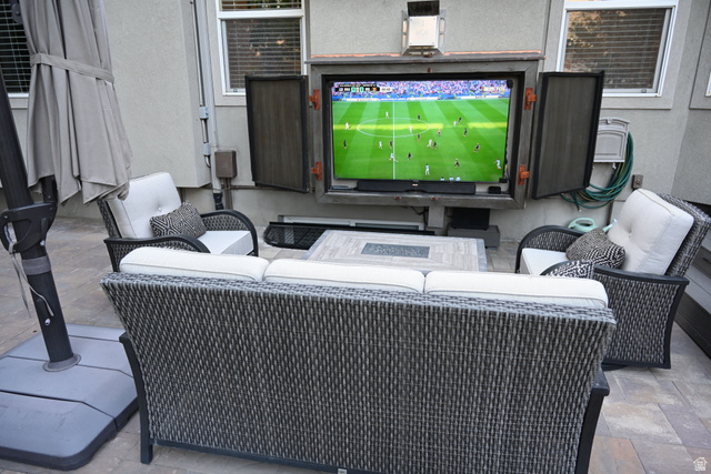 314 Brown Farm Lane Draper, UT 84020 - Photo 39 of 57 Outdoor entertainment area featuring a mounted television in a protective enclosure