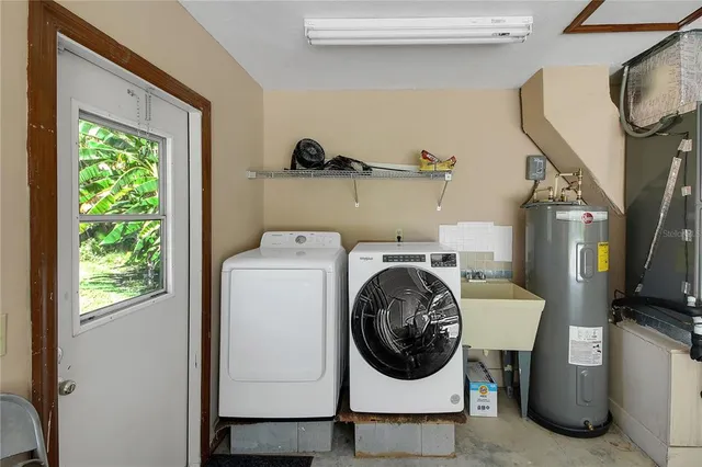 a utility room with dryer and washer