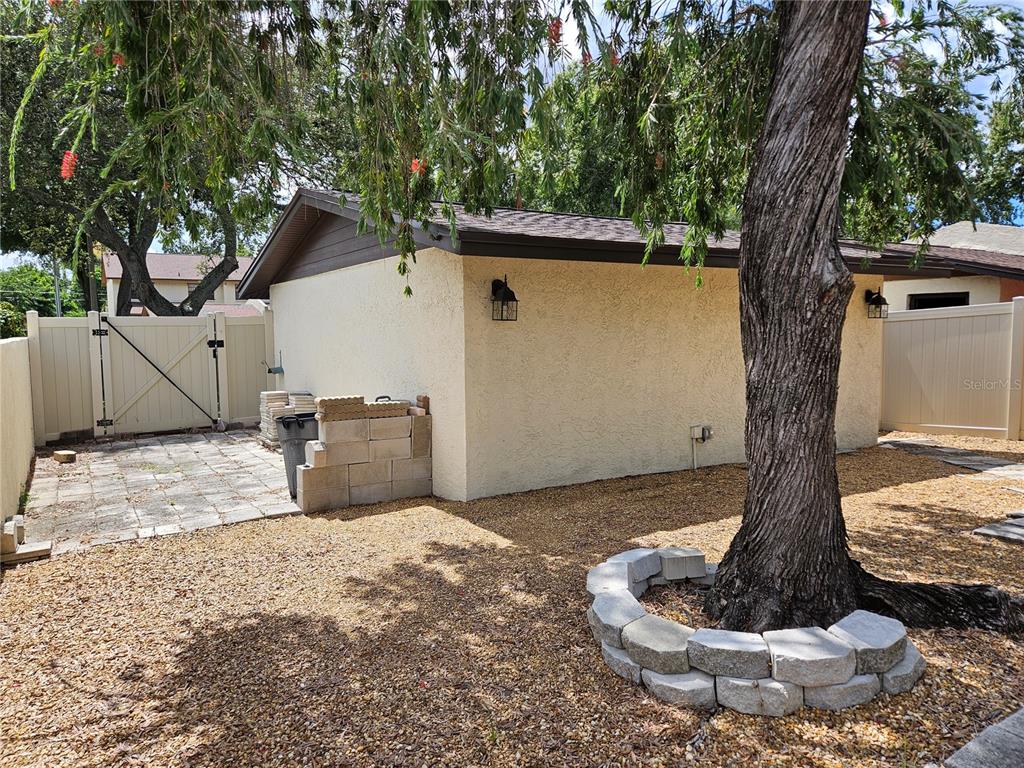 3418 West St Conrad Street Tampa, FL 33607 - Photo 22 of 24 a view of a house with a yard