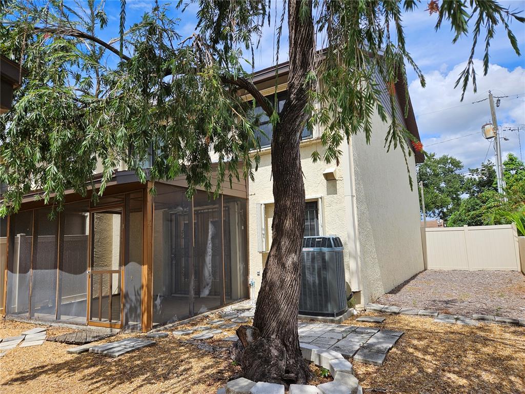 3418 West St Conrad Street Tampa, FL 33607 - Photo 23 of 24 a view of a house with a tree in front