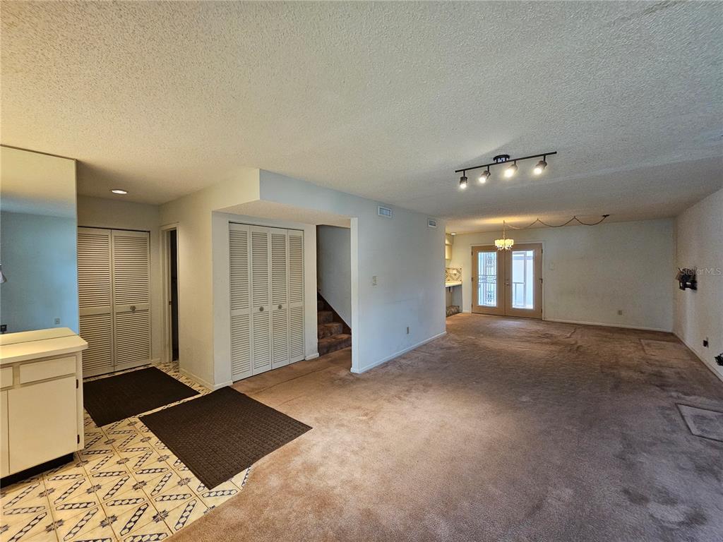 3418 West St Conrad Street Tampa, FL 33607 - Photo 4 of 24 a view of empty room with a rug and a window