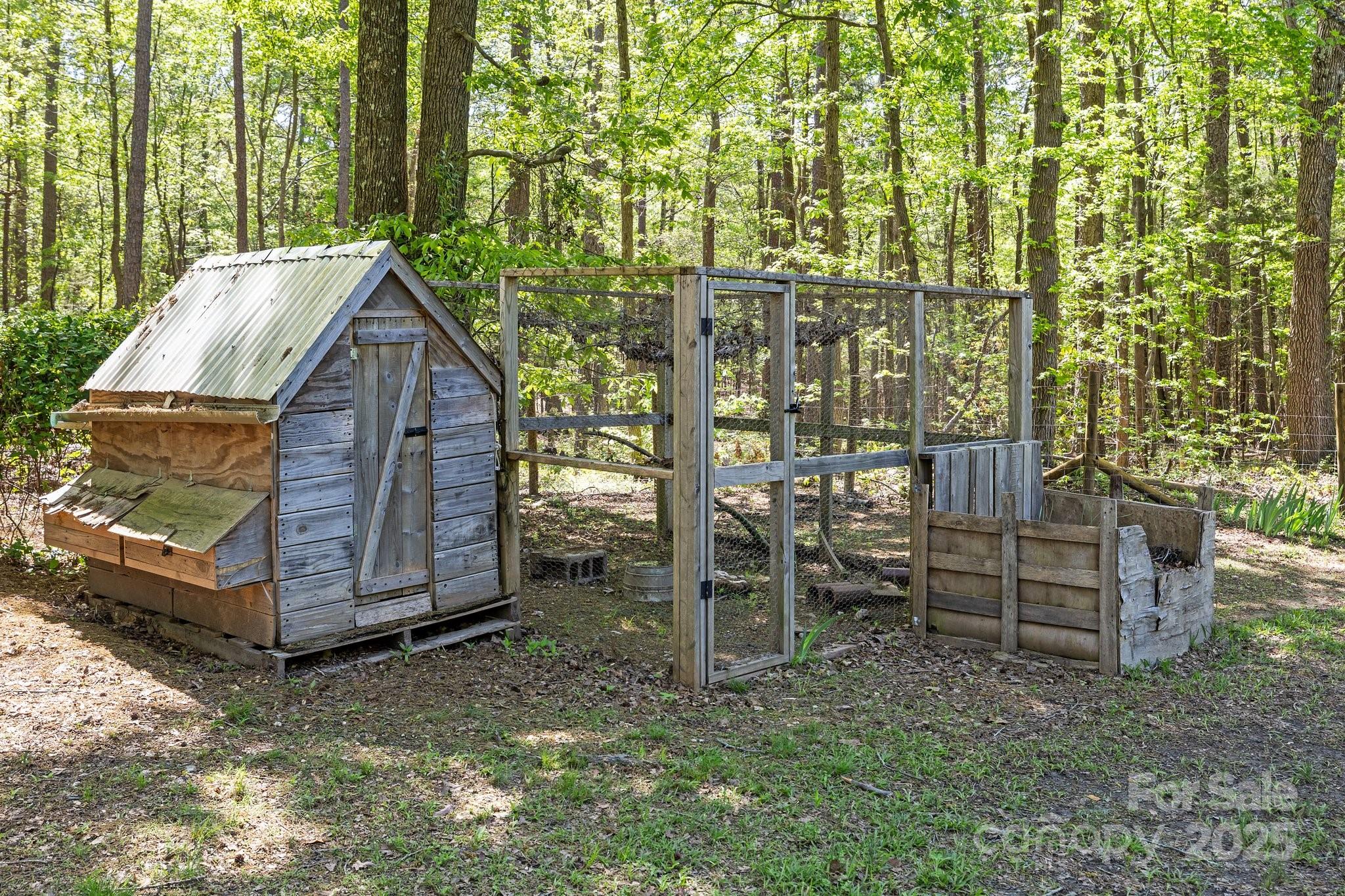 4436 Shiloh Unity Road Lancaster, SC 29720 - Photo 14 of 18 a view of wooden house with a yard and sitting area