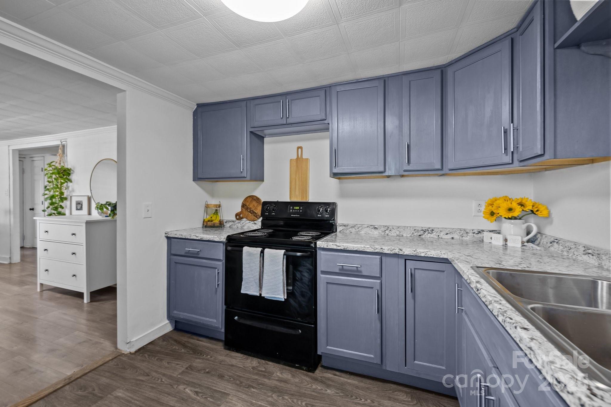 4436 Shiloh Unity Road Lancaster, SC 29720 - Photo 3 of 18 a kitchen with granite countertop wood cabinets and a sink