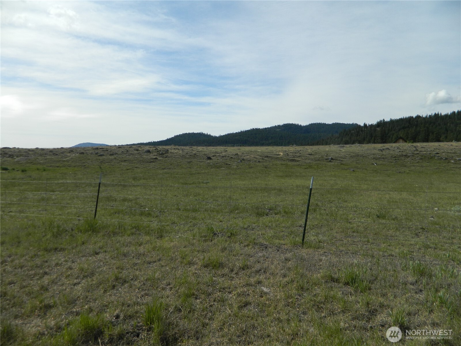 4 Duck Flats Road Tonasket, WA 98855 - Photo 4 of 6 a view of a lake with a mountain