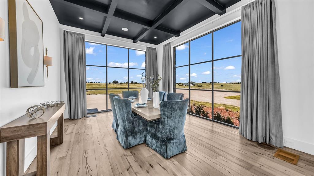 11802 East Rocky Creek Road Crowley, TX 76036 - Photo 14 of 40 a dining room with furniture and wooden floor