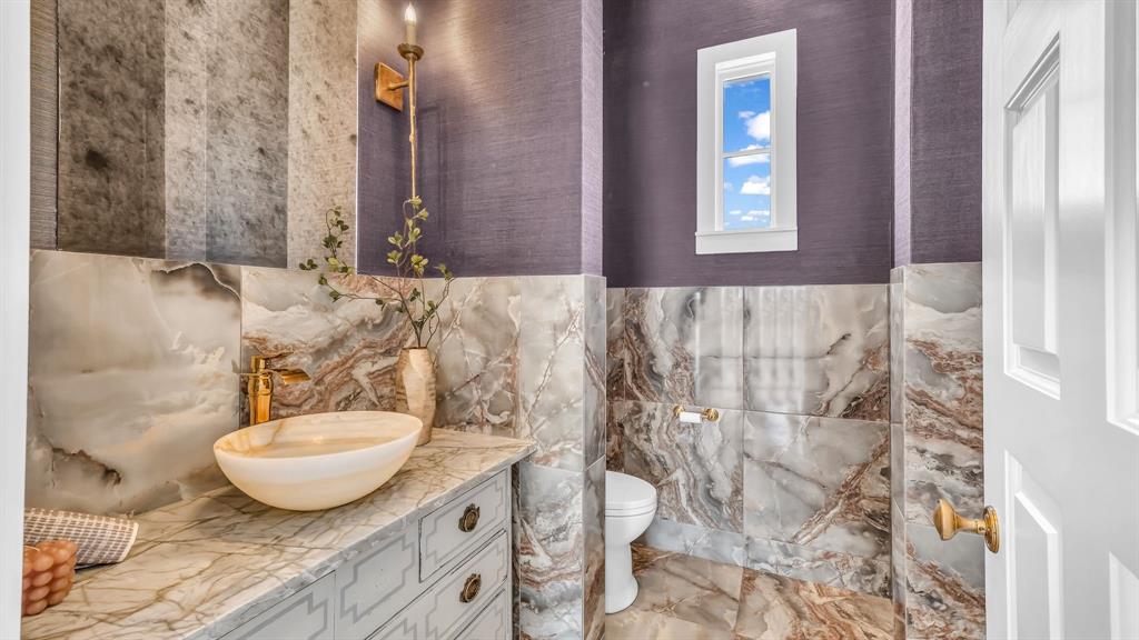 11802 East Rocky Creek Road Crowley, TX 76036 - Photo 21 of 40 a bathroom with a granite countertop sink and a mirror