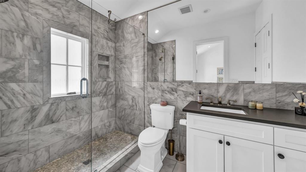 11802 East Rocky Creek Road Crowley, TX 76036 - Photo 24 of 40 a bathroom with a granite countertop sink a toilet and shower