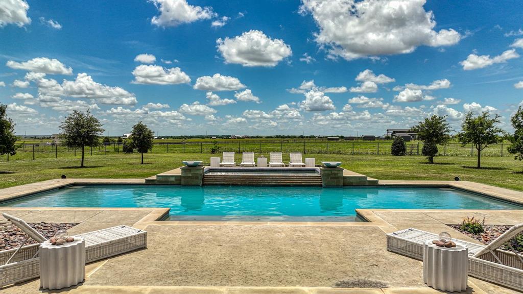 11802 East Rocky Creek Road Crowley, TX 76036 - Photo 29 of 40 a view of a swimming pool with a yard