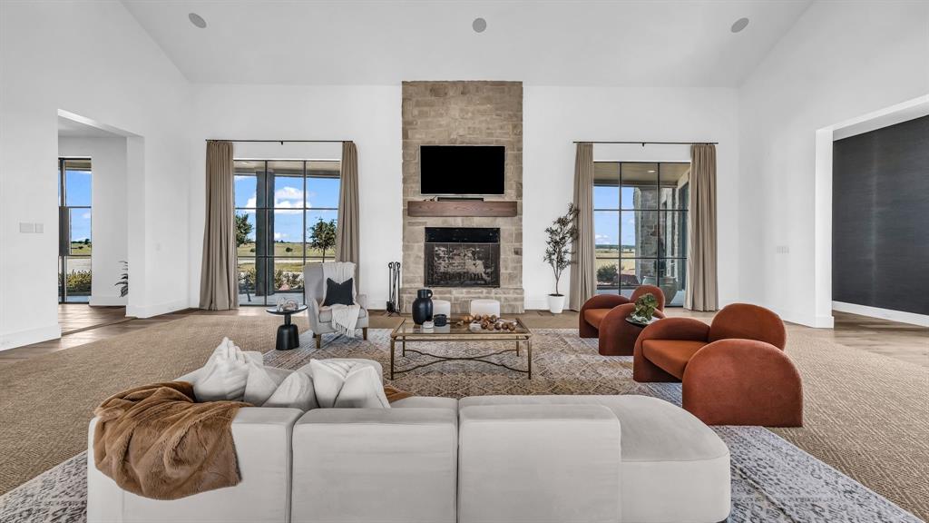 11802 East Rocky Creek Road Crowley, TX 76036 - Photo 3 of 40 a living room with furniture a fireplace and a flat screen tv
