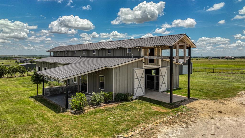 11802 East Rocky Creek Road Crowley, TX 76036 - Photo 31 of 40 a view of a house with backyard porch and sitting area