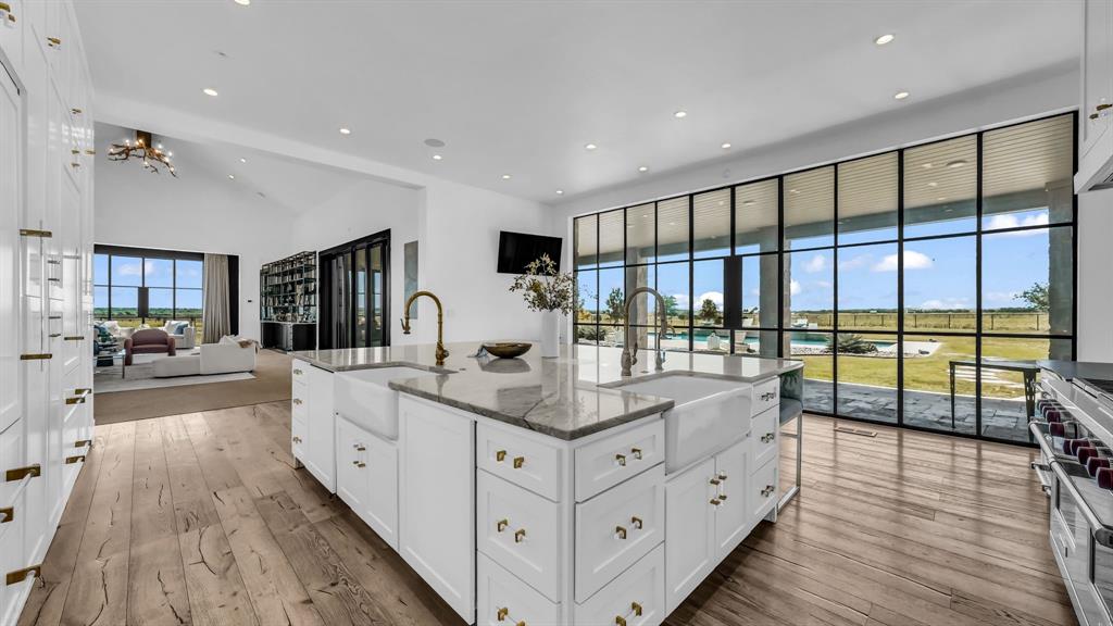 11802 East Rocky Creek Road Crowley, TX 76036 - Photo 4 of 40 a large white kitchen with a large window