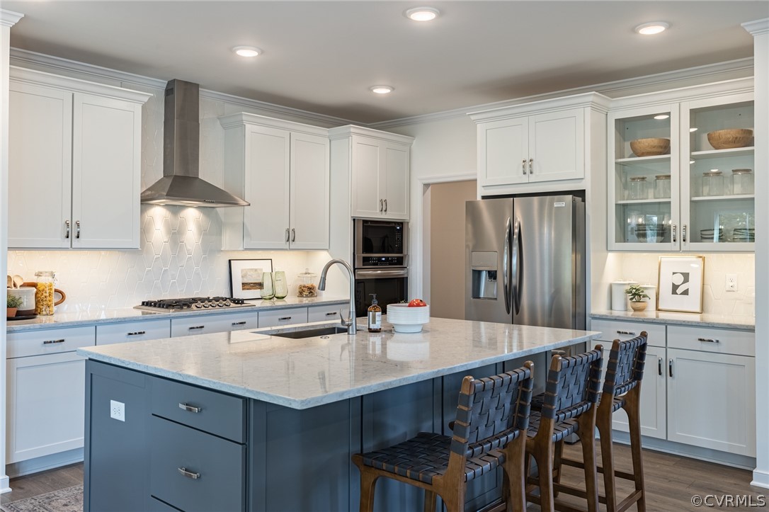 1602 Reed Marsh Place Goochland, VA 23063 - Photo 12 of 41 a kitchen with stainless steel appliances a sink a stove a refrigerator cabinets and a dining table