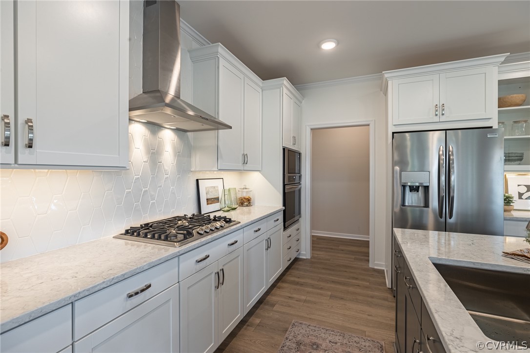 1602 Reed Marsh Place Goochland, VA 23063 - Photo 17 of 41 a kitchen with stainless steel appliances granite countertop a sink stove and refrigerator