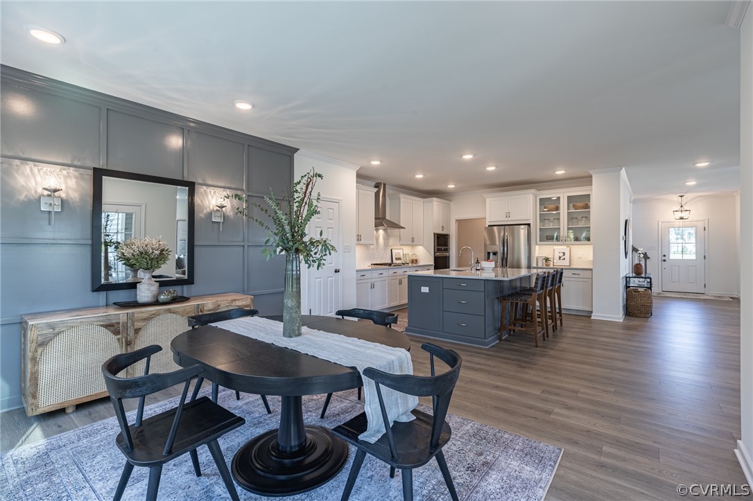 1602 Reed Marsh Place Goochland, VA 23063 - Photo 20 of 41 a view of a dining room with furniture and wooden floor