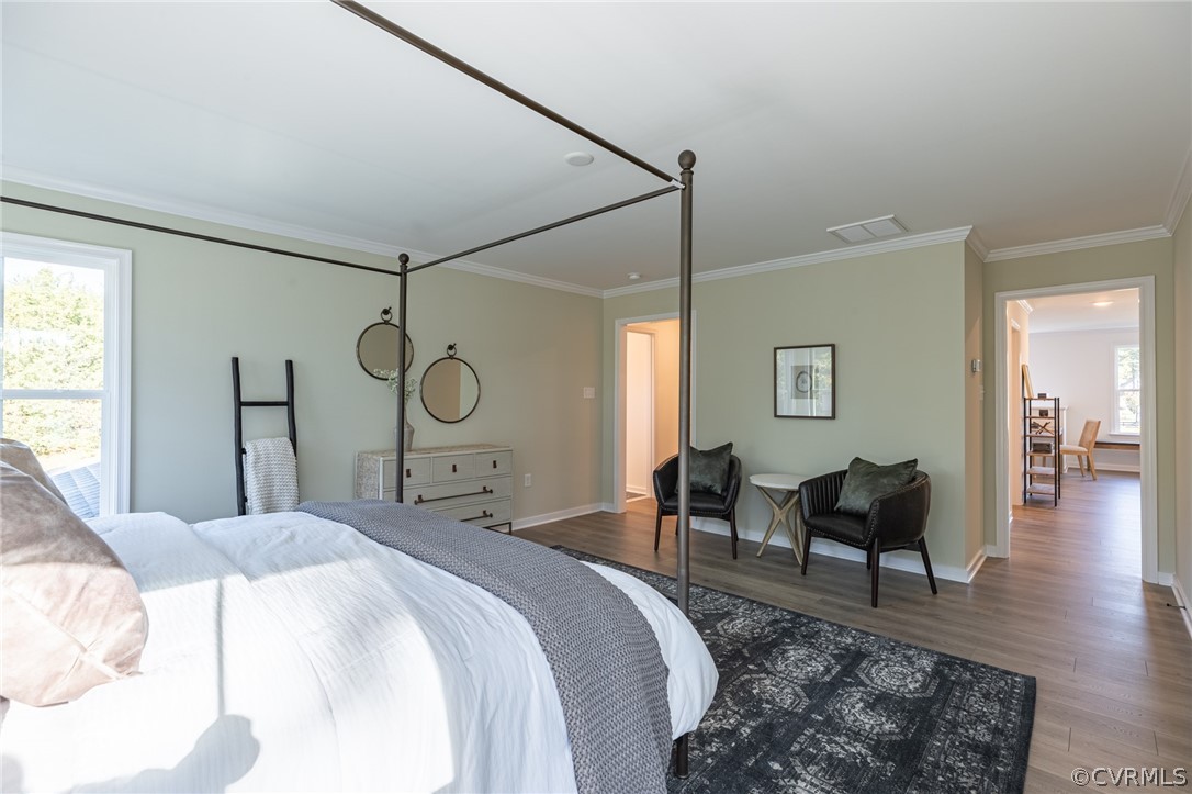 1602 Reed Marsh Place Goochland, VA 23063 - Photo 23 of 41 a bed room with a bed a mirror and a window