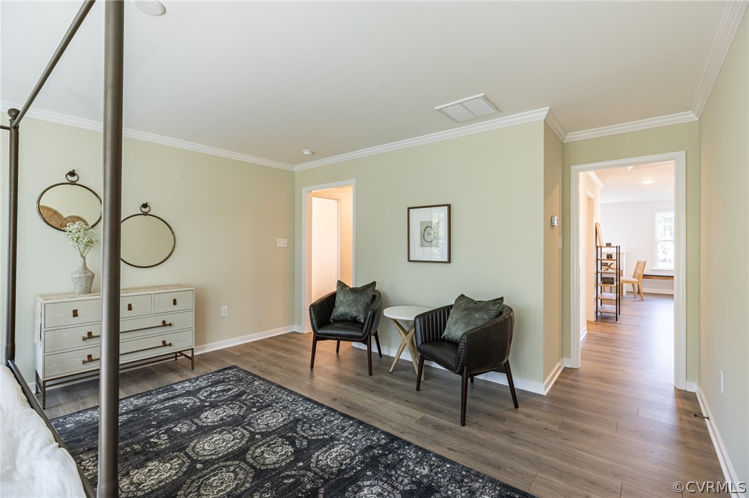 1602 Reed Marsh Place Goochland, VA 23063 - Photo 24 of 41 a living room with furniture a dining table and wooden floor