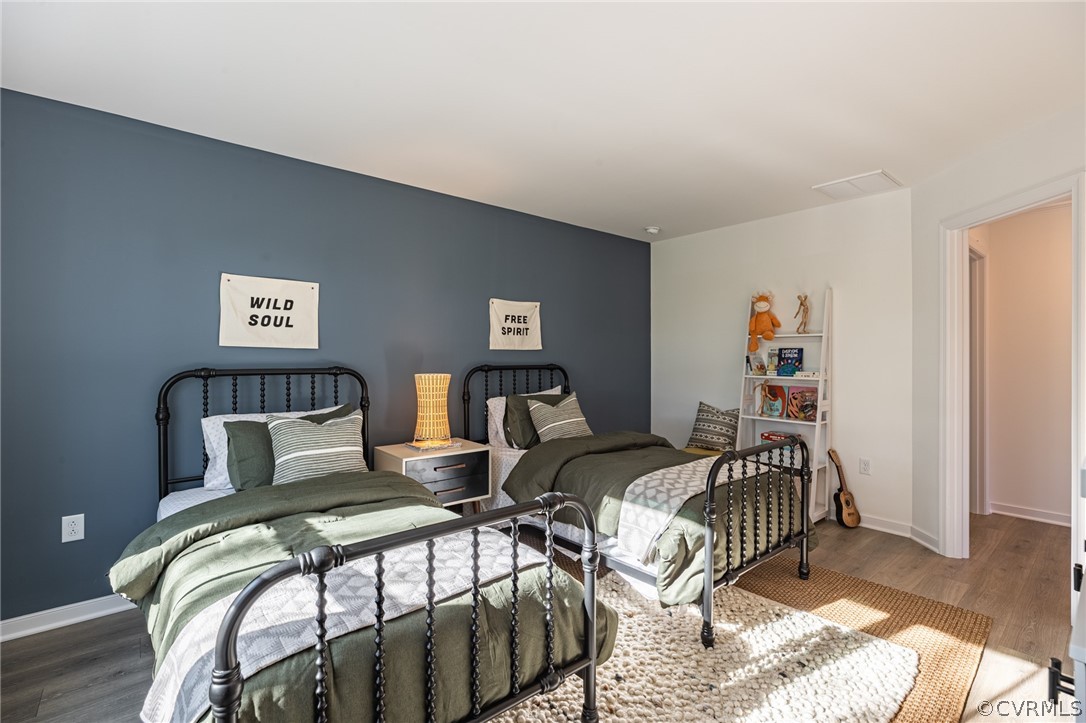 1602 Reed Marsh Place Goochland, VA 23063 - Photo 27 of 41 a bedroom with two beds and a painting on the wall