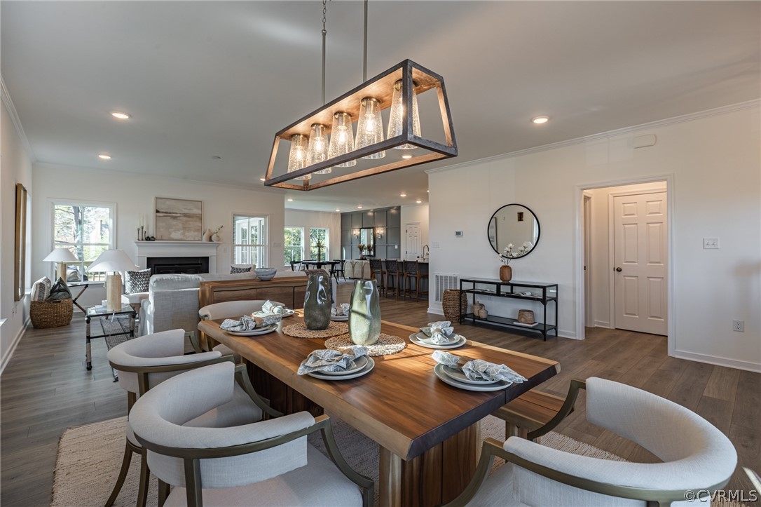1602 Reed Marsh Place Goochland, VA 23063 - Photo 4 of 41 a living room with furniture a rug and a clock