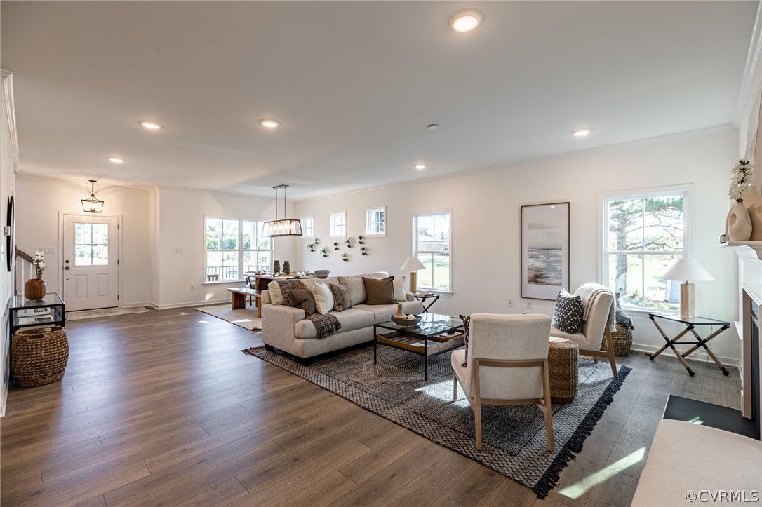 1602 Reed Marsh Place Goochland, VA 23063 - Photo 7 of 41 a living room with furniture wooden floor and a large window