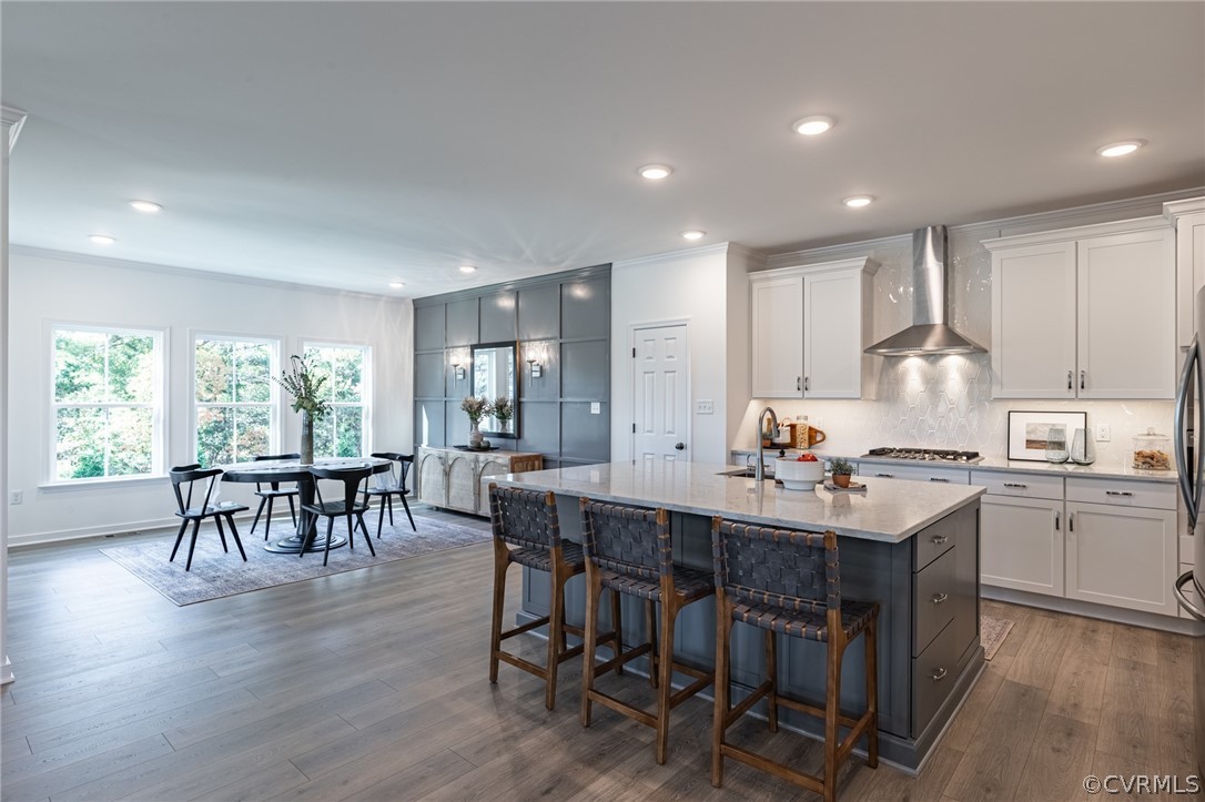 1602 Reed Marsh Place Goochland, VA 23063 - Photo 9 of 41 a kitchen with appliances a table and chairs in it