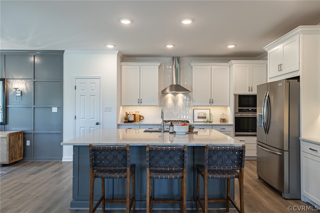 1602 Reed Marsh Place Goochland, VA 23063 - Photo 10 of 41 a kitchen with refrigerator a sink and chairs