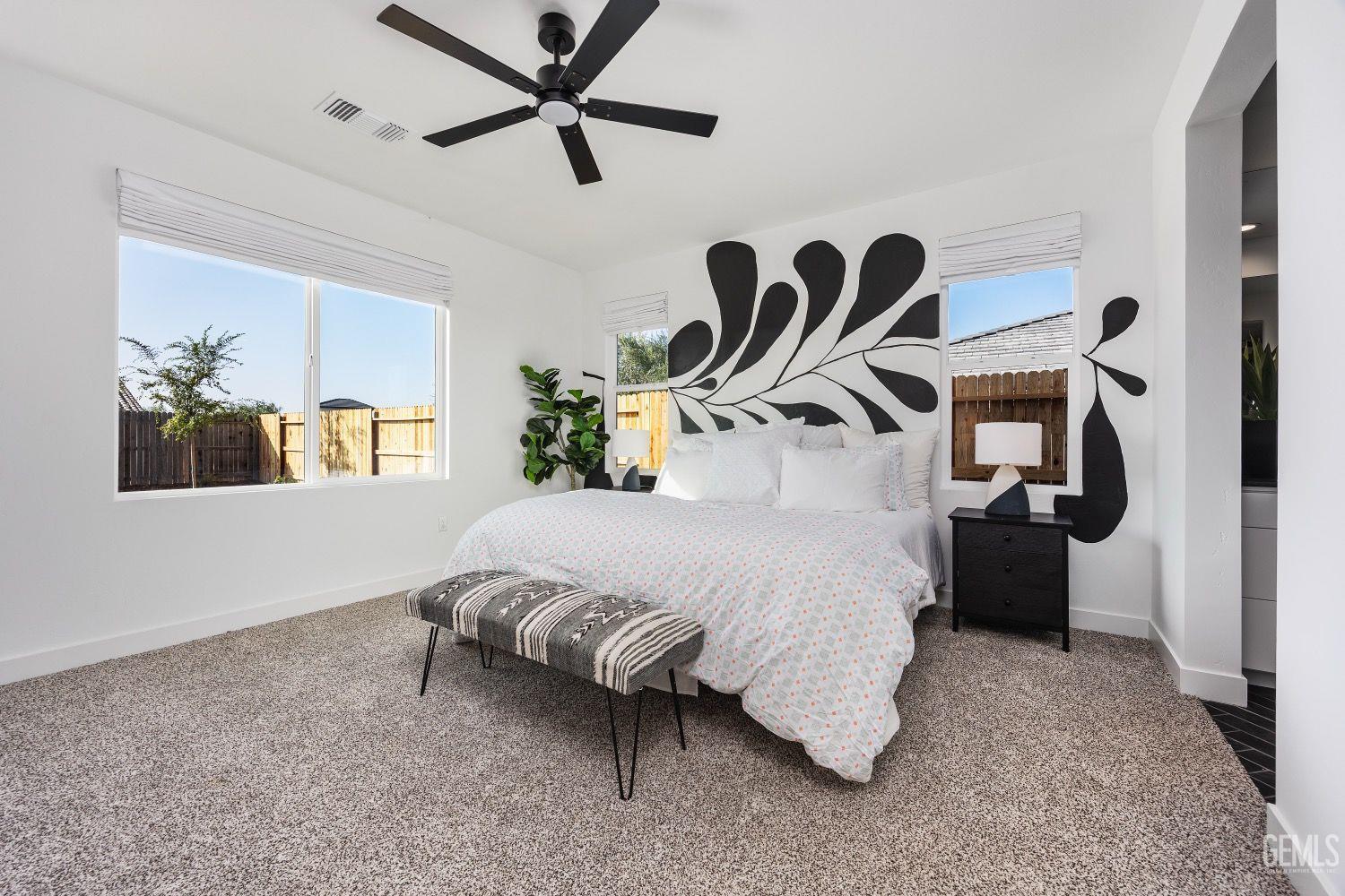 Undisclosed Address Bakersfield, CA 93314 - Photo 13 of 26 a bed room with a bed and a painting on the wall