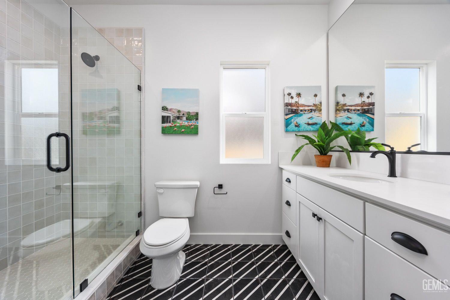 Undisclosed Address Bakersfield, CA 93314 - Photo 16 of 26 a bathroom with a shower sink and toilet