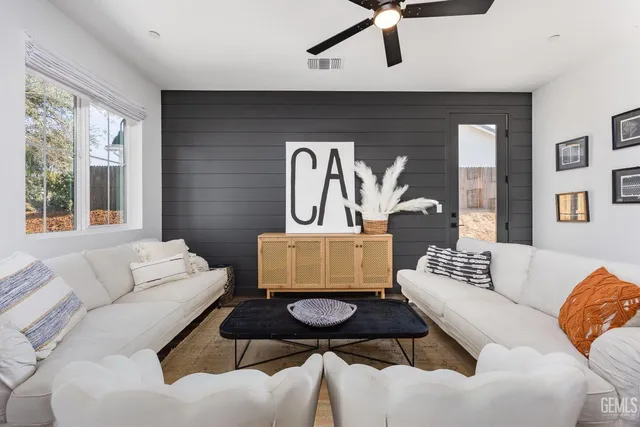 a living room with furniture and a large window