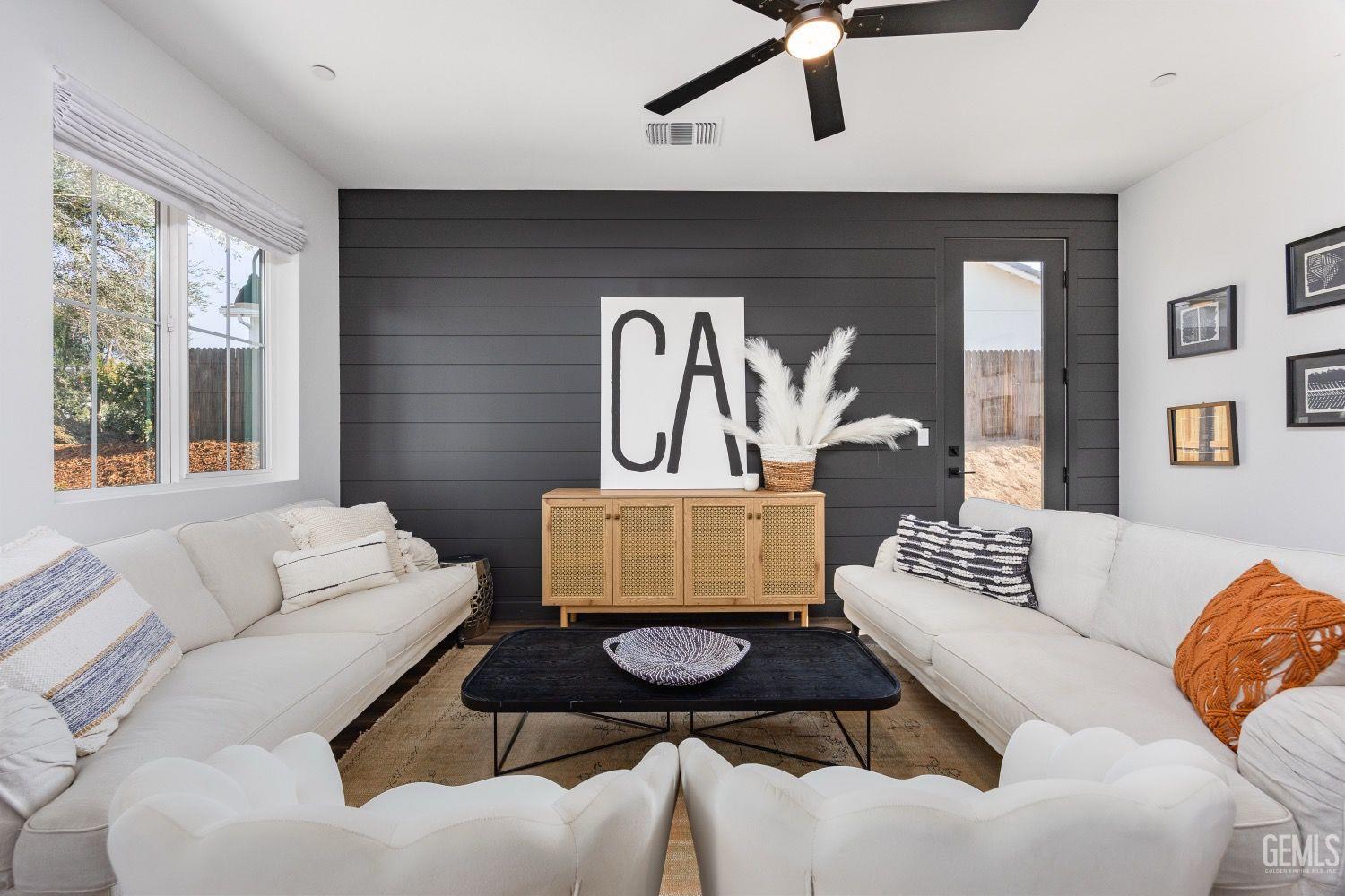 Undisclosed Address Bakersfield, CA 93314 - Photo 24 of 26 a living room with furniture and a large window