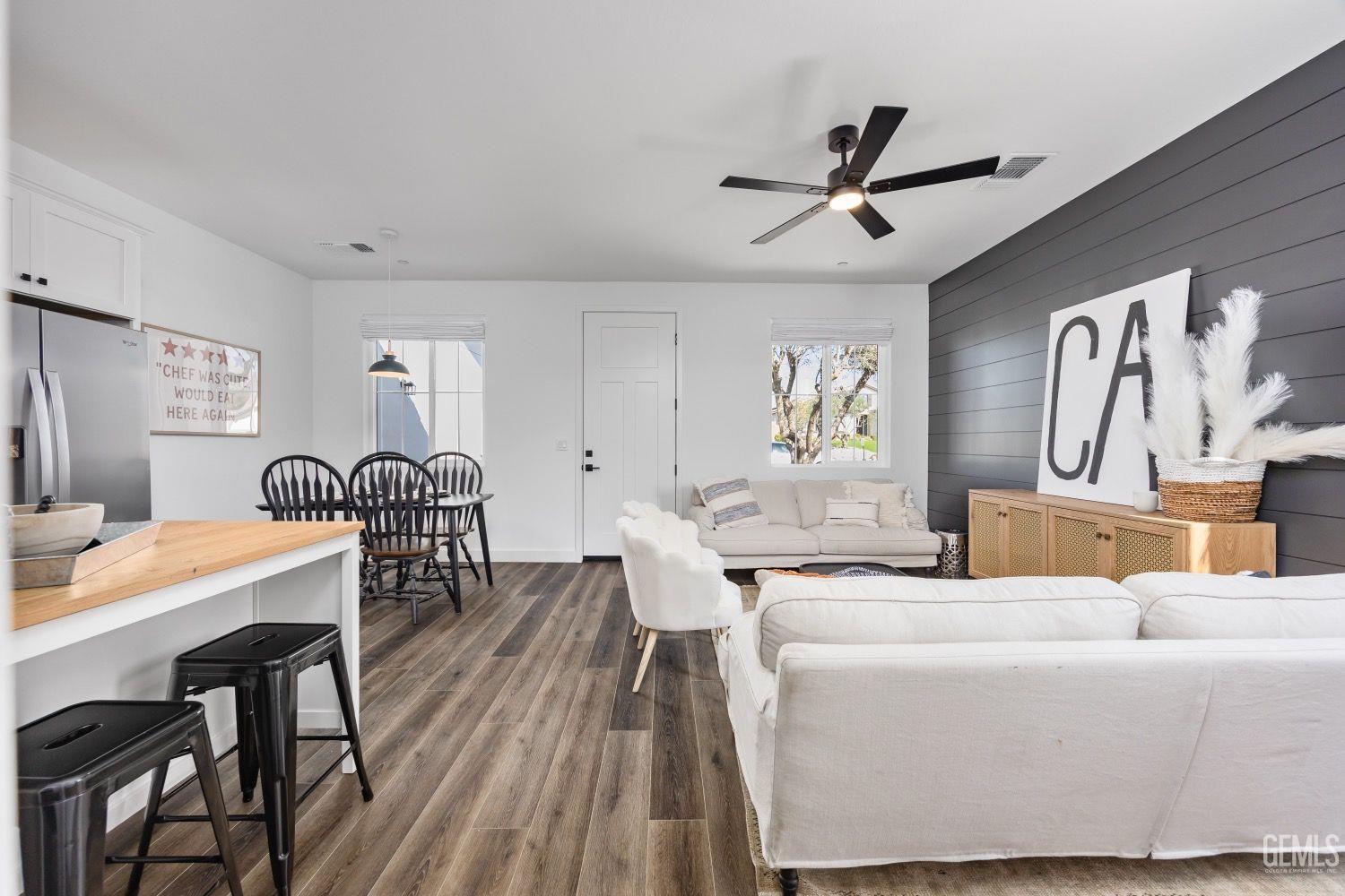 Undisclosed Address Bakersfield, CA 93314 - Photo 26 of 26 a living room with furniture a window and wooden floor