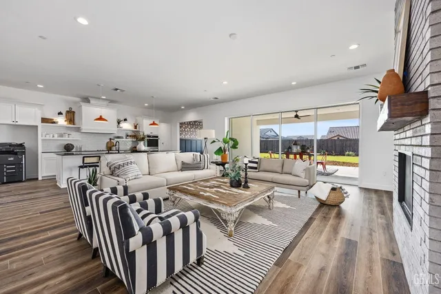 a living room with furniture fireplace and a flat screen tv