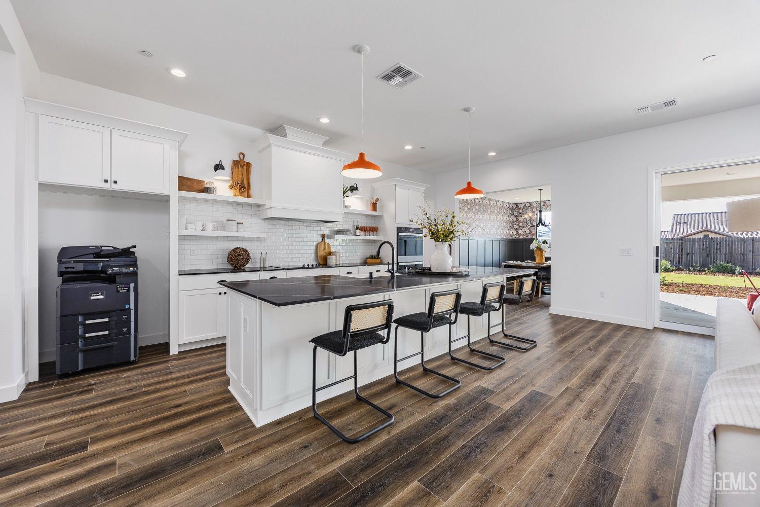 Undisclosed Address Bakersfield, CA 93314 - Photo 8 of 26 a kitchen with stainless steel appliances granite countertop a sink stove and refrigerator