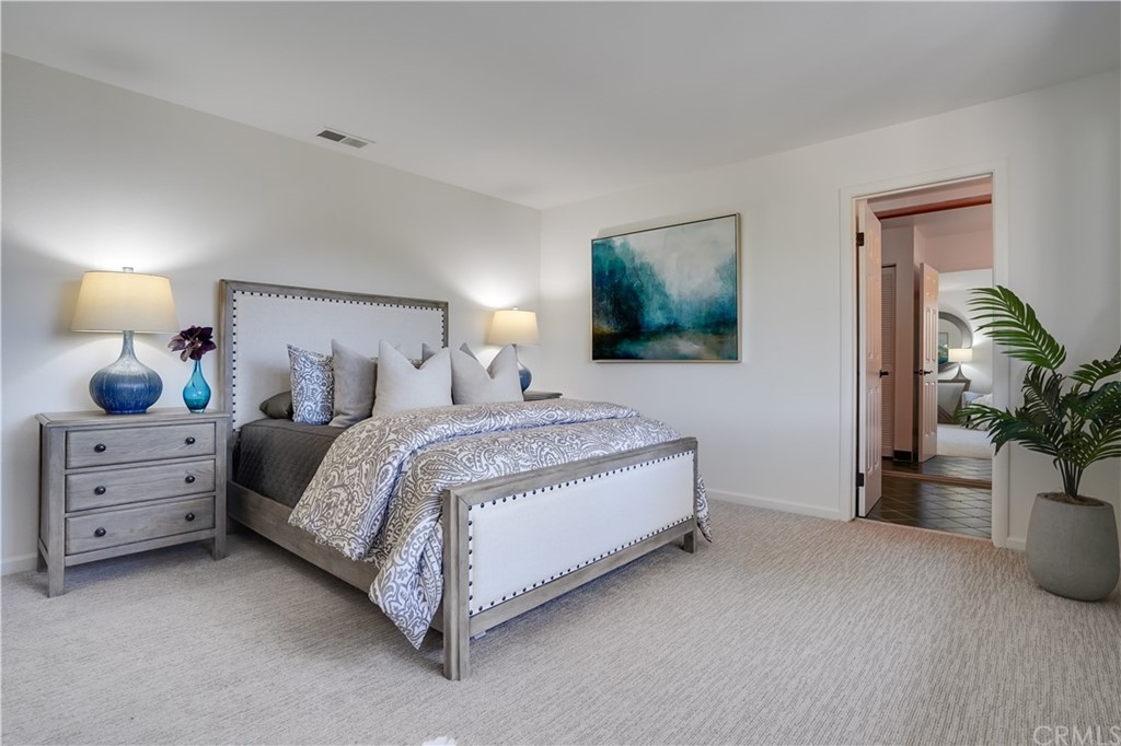 1988 Timberlane Way San Mateo, CA 94402 - Photo 12 of 36 a spacious bedroom with a bed and a couch