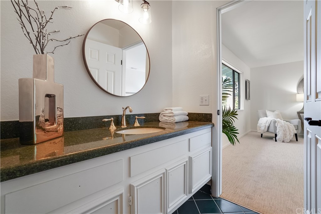 1988 Timberlane Way San Mateo, CA 94402 - Photo 13 of 36 a spacious bathroom with a double vanity sink and a mirror