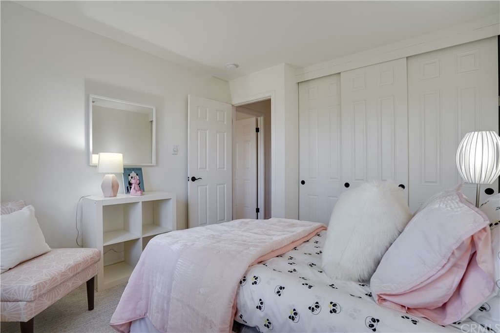 1988 Timberlane Way San Mateo, CA 94402 - Photo 14 of 36 a bedroom with a bed and a chair