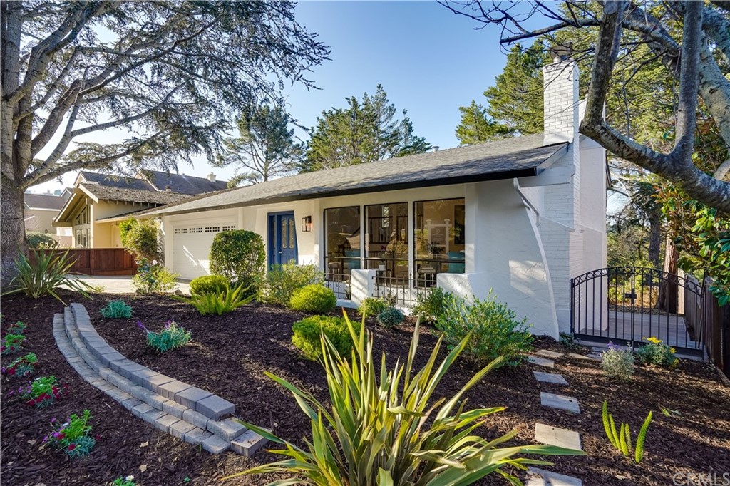 1988 Timberlane Way San Mateo, CA 94402 - Photo 2 of 36 a front view of a house with garden