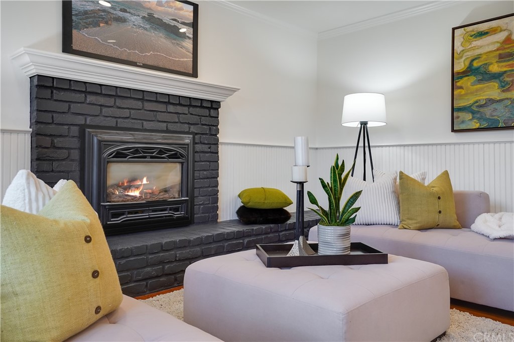 1988 Timberlane Way San Mateo, CA 94402 - Photo 24 of 36 a living room with furniture a fireplace and a lamp