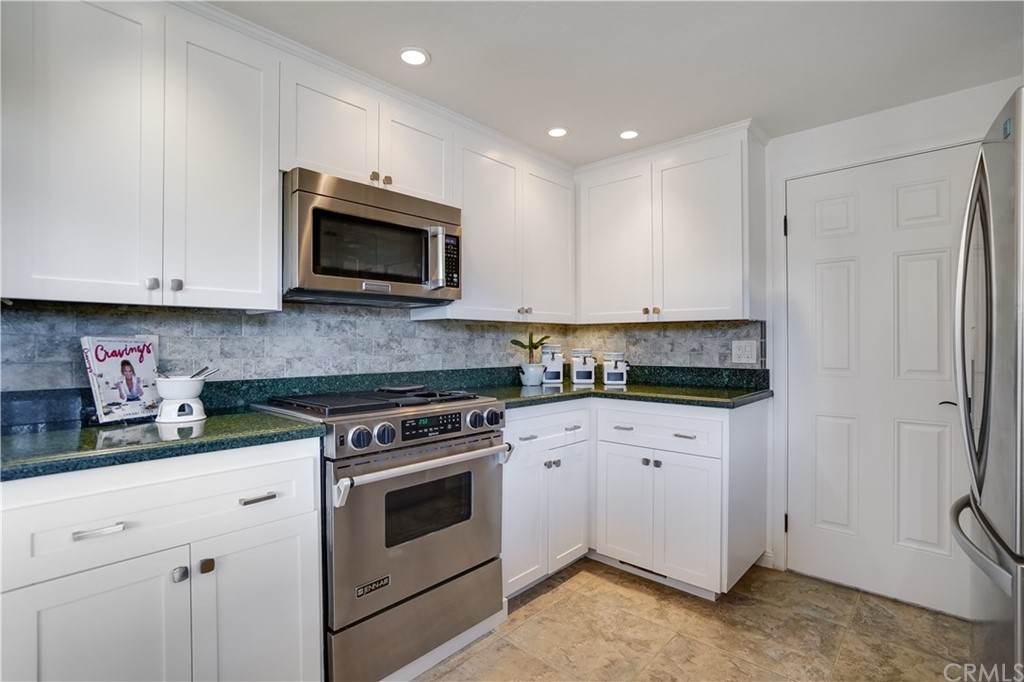 1988 Timberlane Way San Mateo, CA 94402 - Photo 26 of 36 a kitchen with appliances a sink and cabinets
