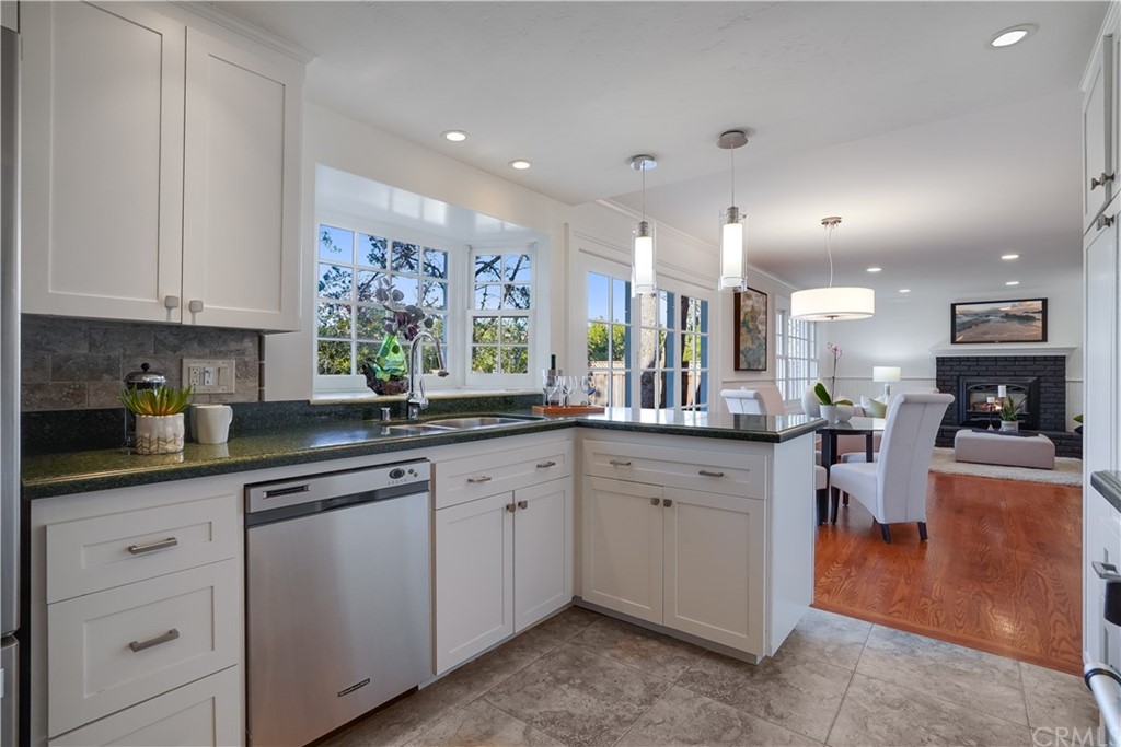 1988 Timberlane Way San Mateo, CA 94402 - Photo 27 of 36 a kitchen with stainless steel appliances granite countertop refrigerator sink and cabinets