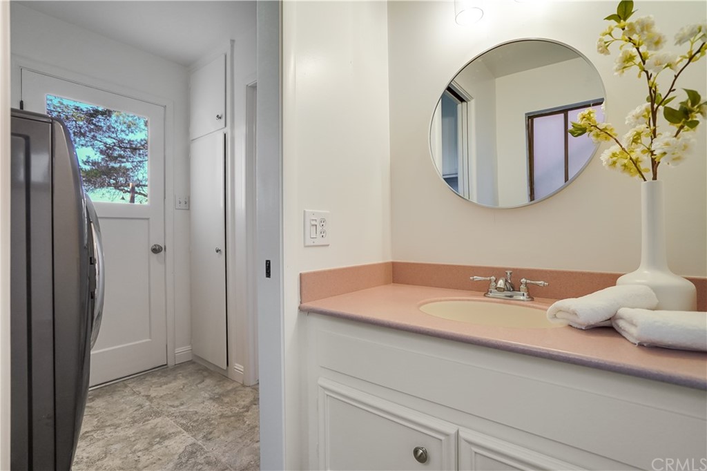 1988 Timberlane Way San Mateo, CA 94402 - Photo 32 of 36 a bathroom with a sink and a mirror