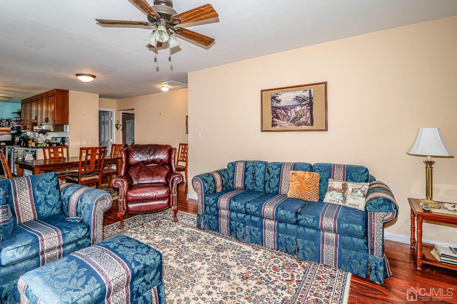 106 Winthrop Road Edison, NJ 08817 - Photo 8 of 38 a living room with furniture a couch and a chandelier