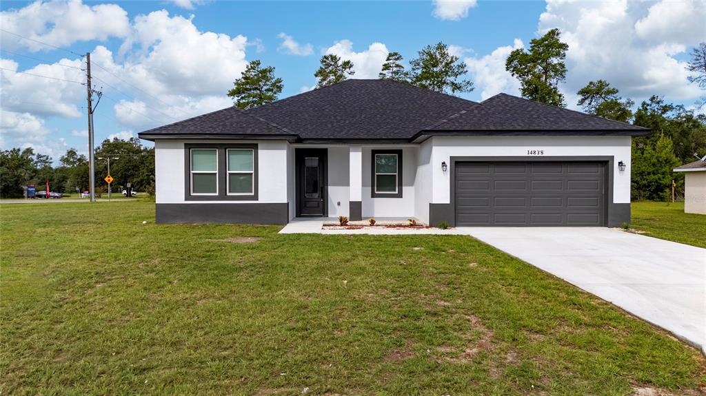 14838 Southwest 29th Av Road Ocala, FL 34473 - Photo 1 of 1 a front view of a house with a yard