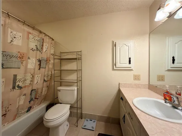 a view of a swimming pool with a yard and trees