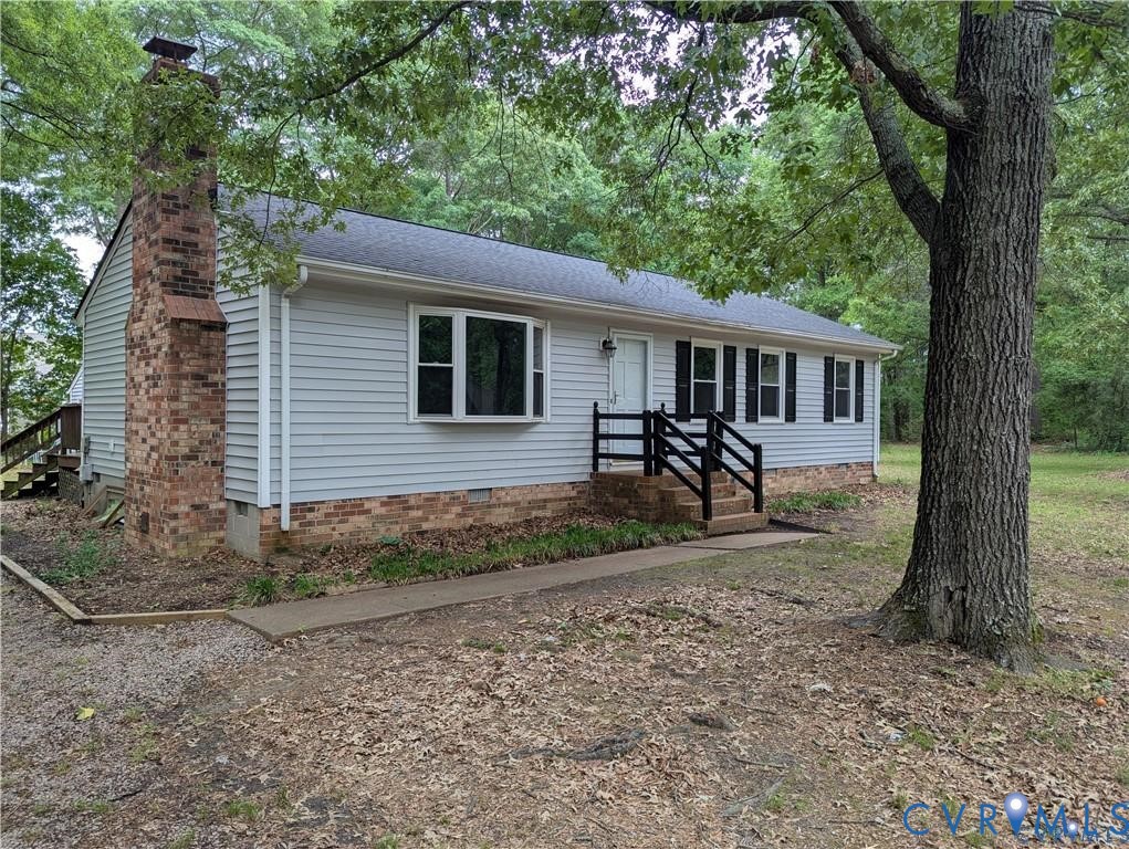 2597 Varney Road Henrico, VA 23231 - Photo 1 of 24 Light-colored siding exterior with a dark shingle