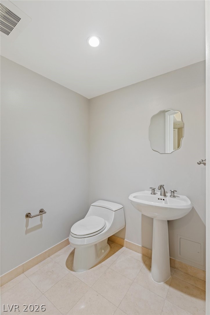 2777 Paradise Road, Unit 901 Las Vegas, NV 89109 - Photo 17 of 27 Bathroom featuring toilet, tile patterned flooring, baseboards, and visible vents