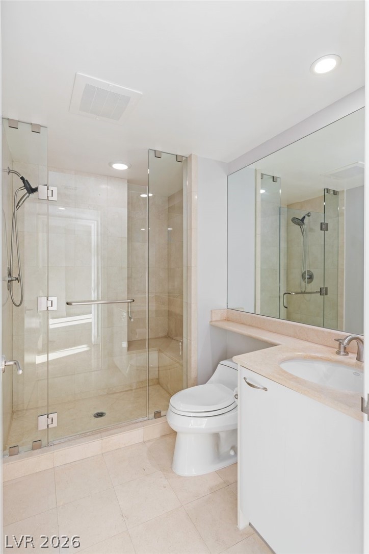 2777 Paradise Road, Unit 901 Las Vegas, NV 89109 - Photo 22 of 27 Full bathroom featuring visible vents, toilet, and a shower stall