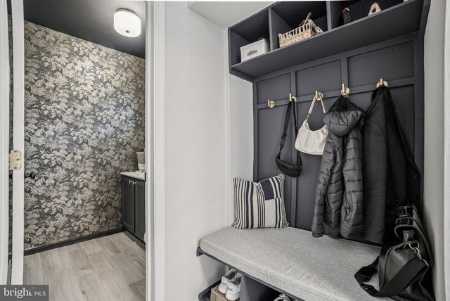 a room with a sink and a mirror