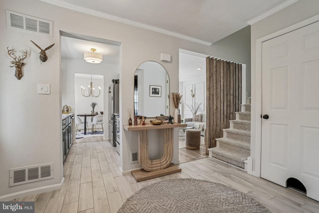 a view of a living room with a fireplace